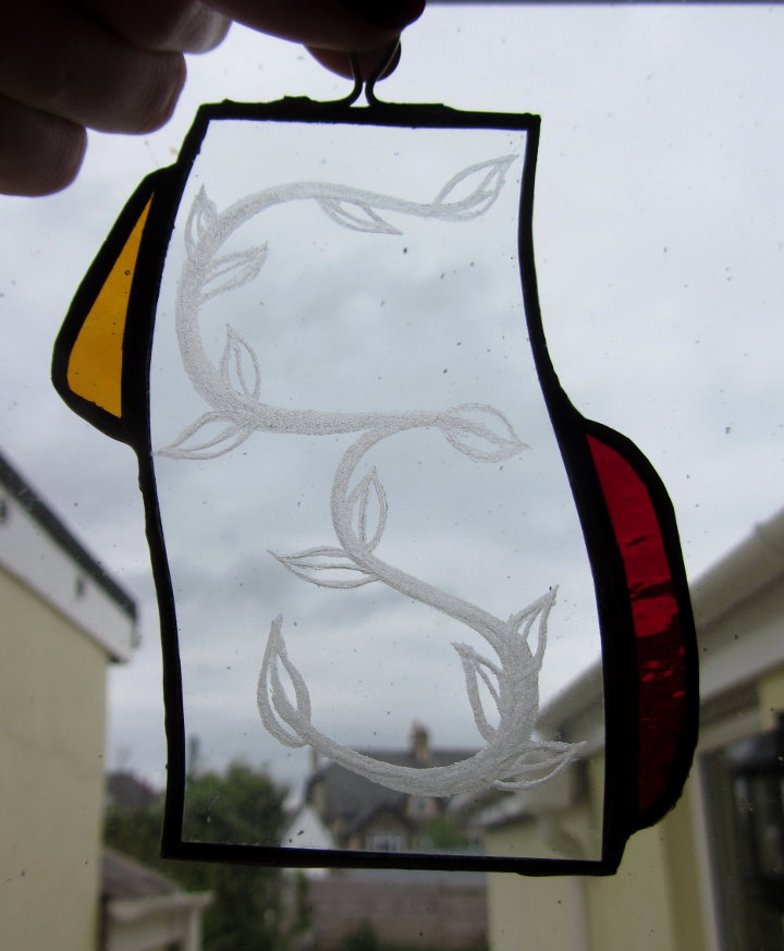 Engraved stained glass window